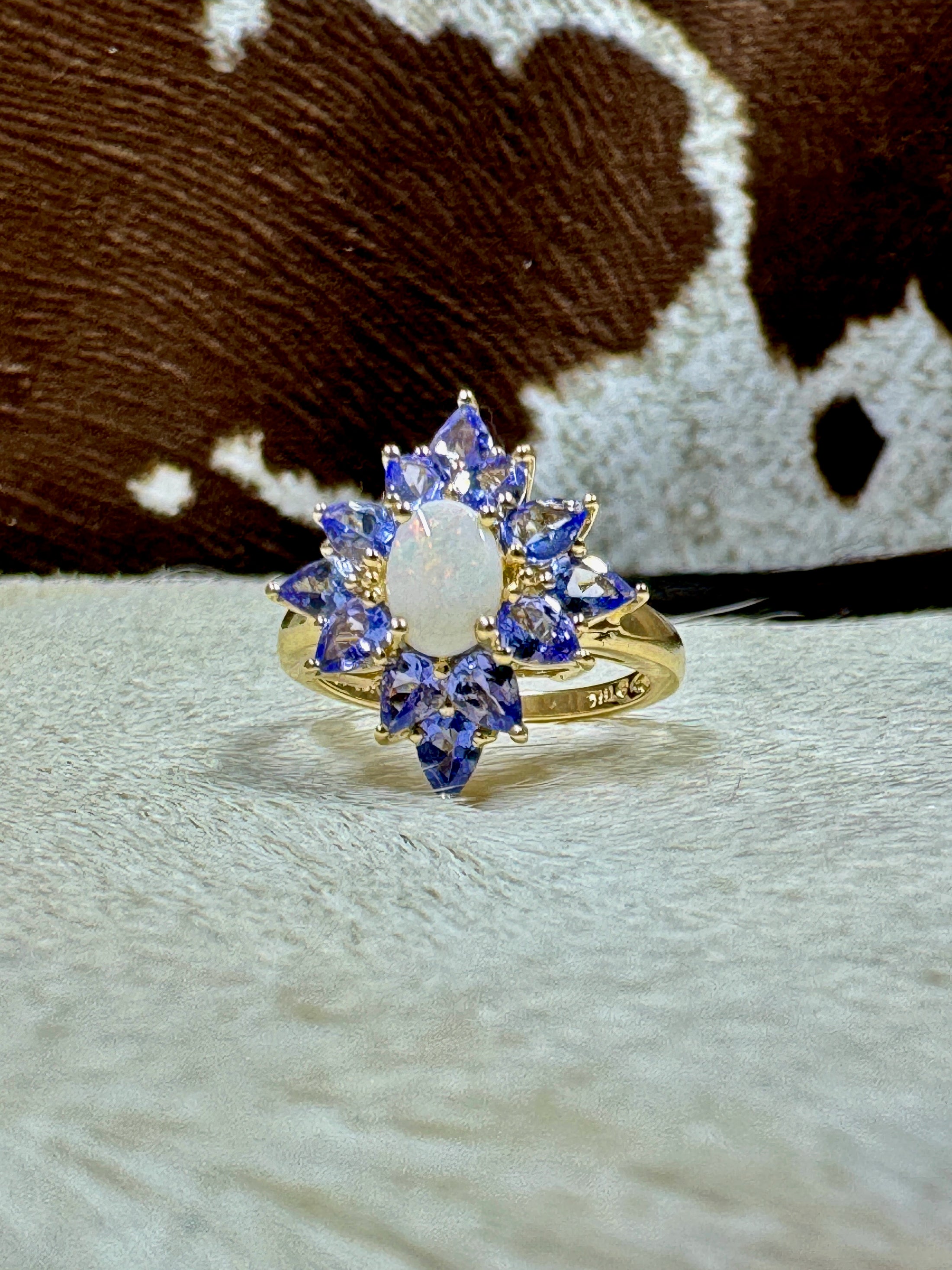 Tanzanite and Opal 10K Gold Ring on cowhide