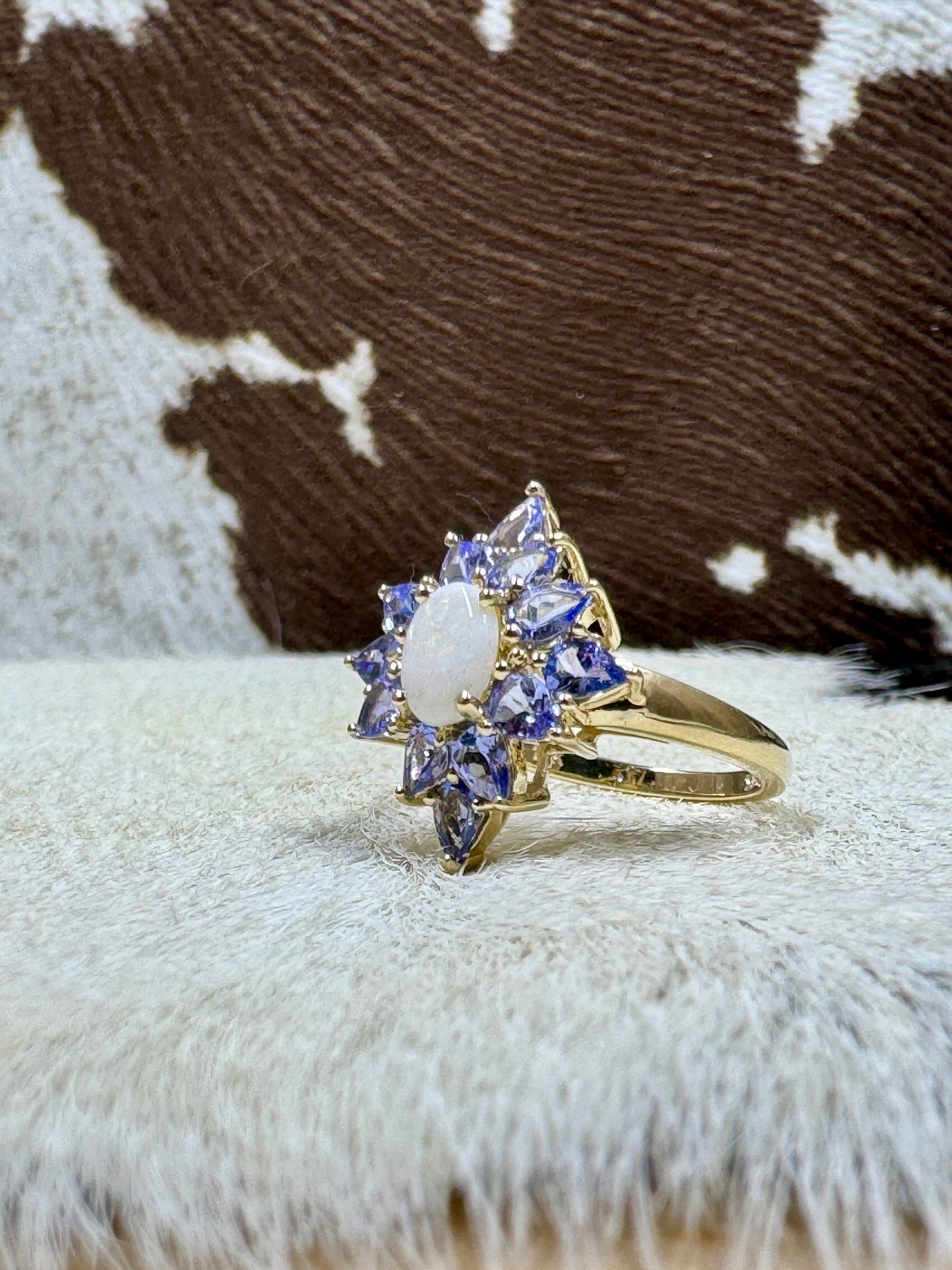 Tanzanite and Opal 10K Gold Ring on cowhide